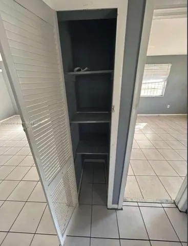 a view of an empty room and window