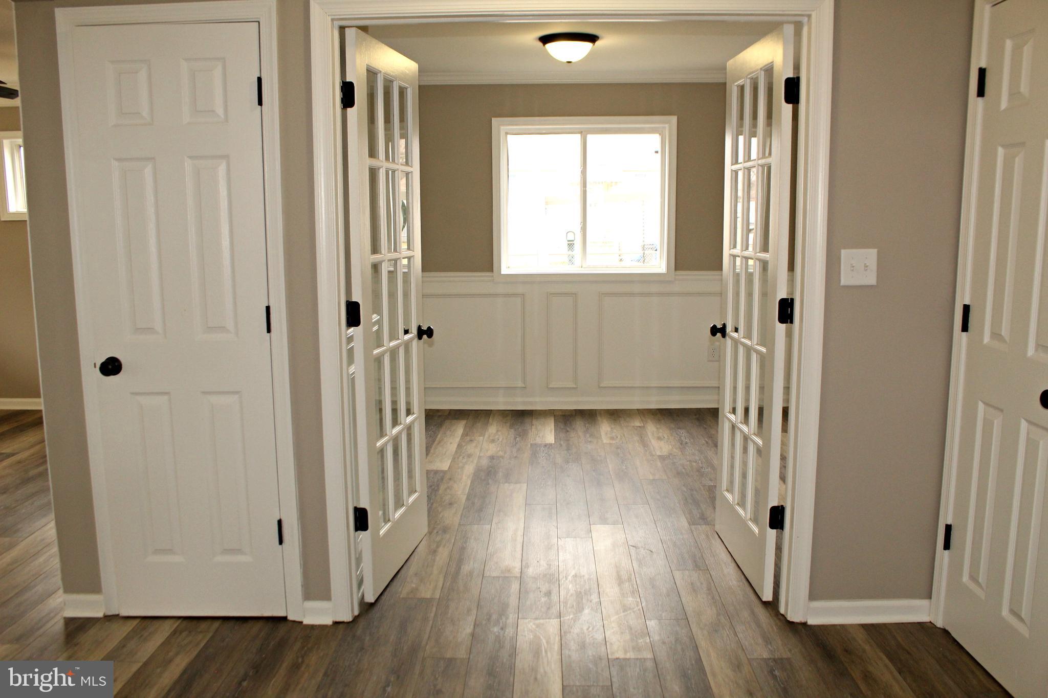 545 Compass Road East Baltimore, MD 21220 - Photo 8 of 30 a view of a room with wooden floor and a window