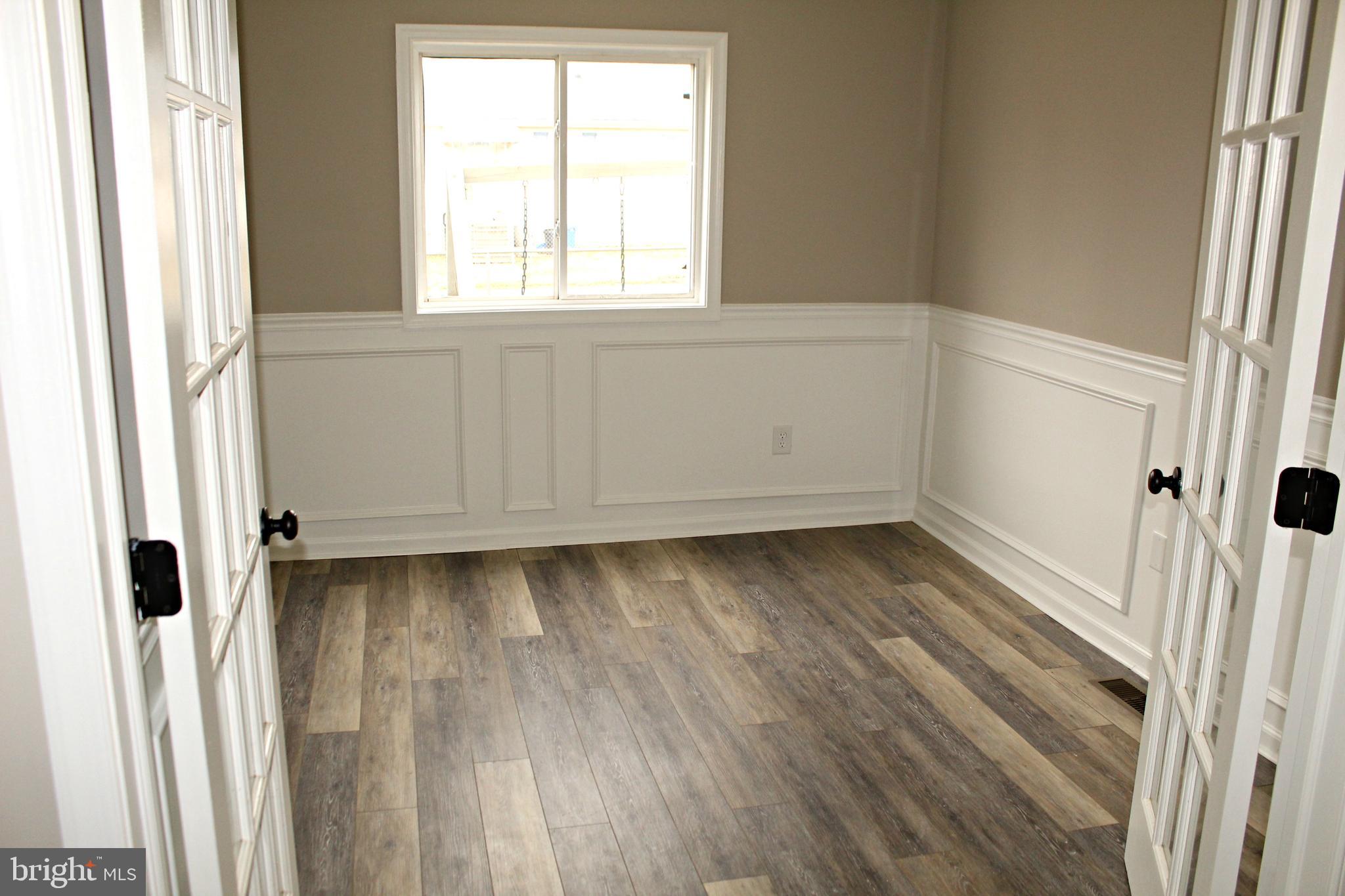 545 Compass Road East Baltimore, MD 21220 - Photo 9 of 30 a view of a room with wooden floor and window