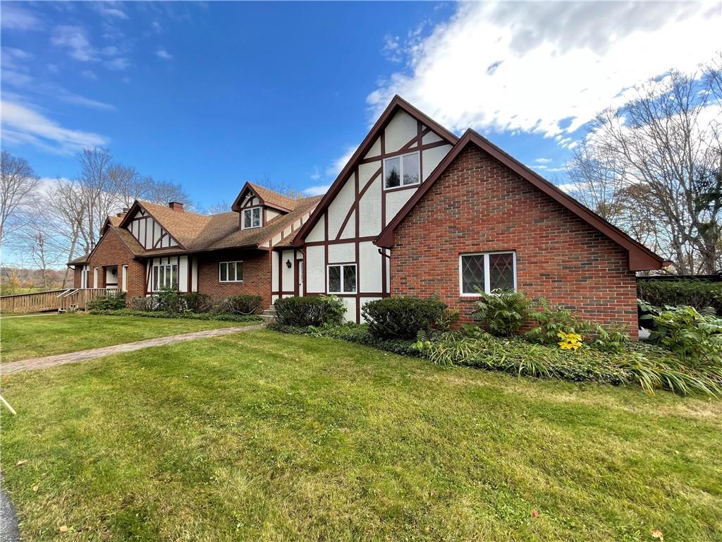 a front view of a house with a yard