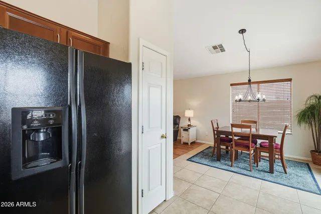 a dining room with furniture and chandelier