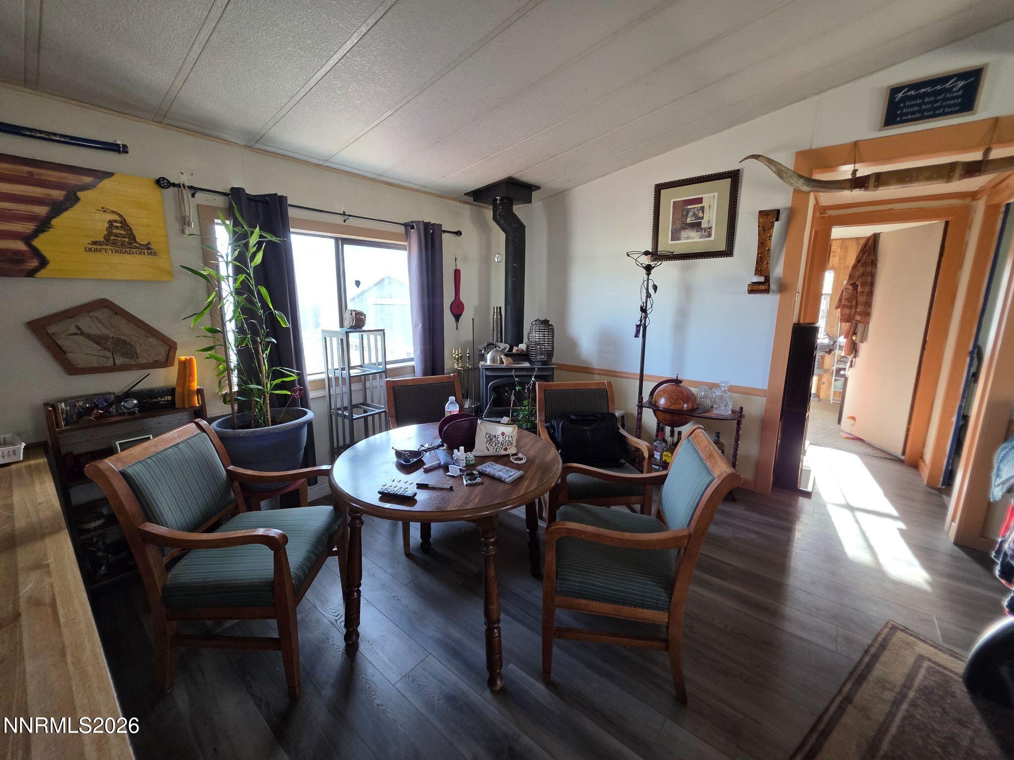 3985 Granite Way Topaz Ranch Estates, NV 89444 - Photo 21 of 34 a view of a dining room with furniture window and wooden floor