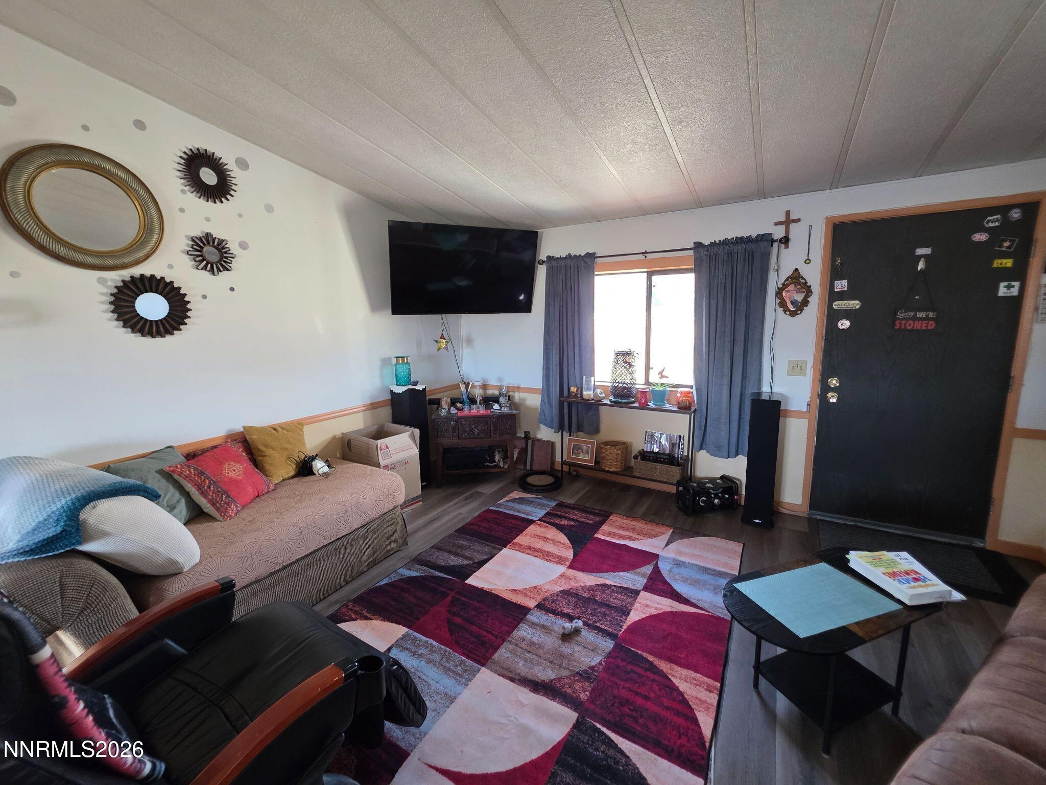3985 Granite Way Topaz Ranch Estates, NV 89444 - Photo 23 of 34 a living room with furniture and a flat screen tv