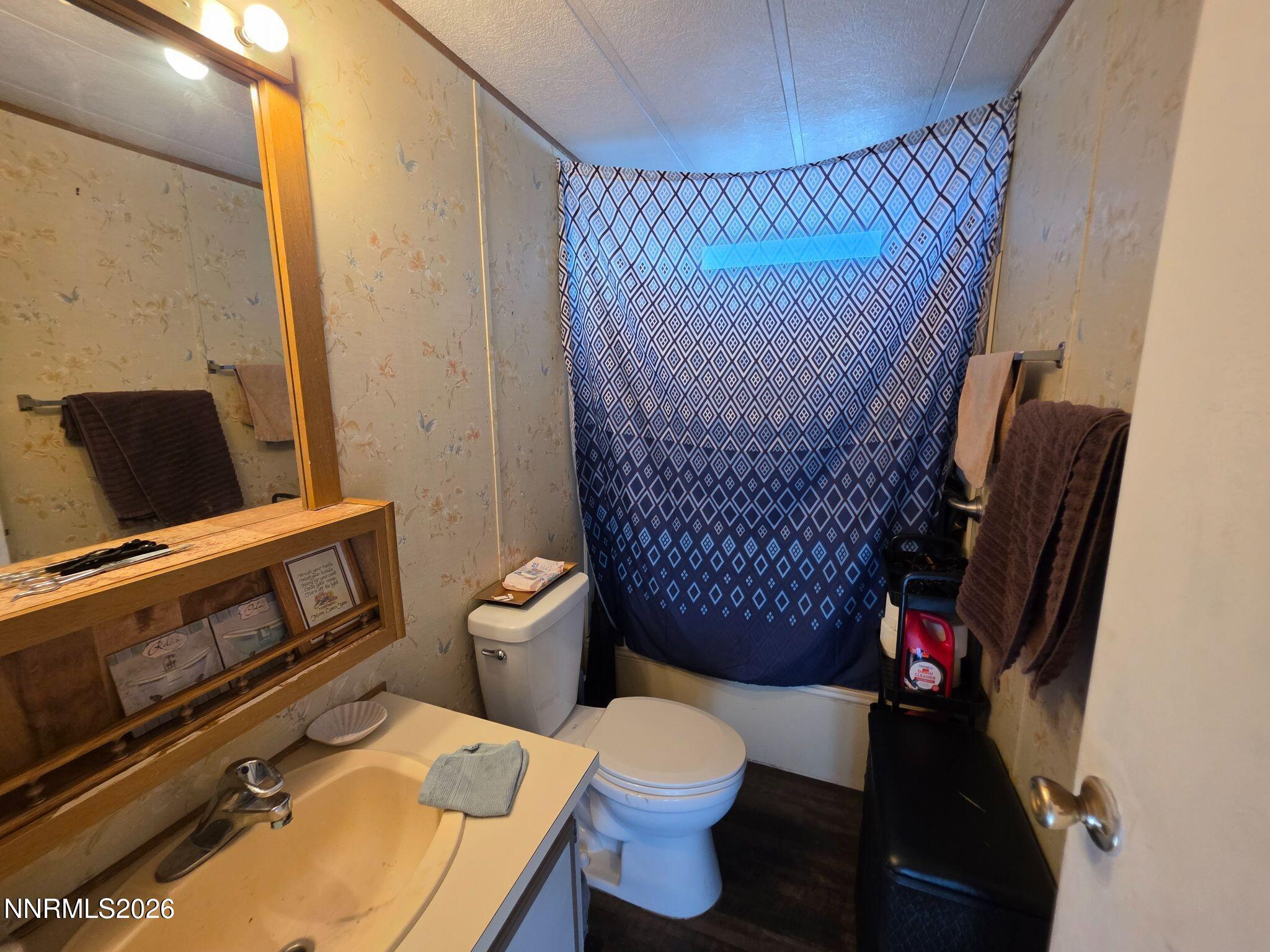 3985 Granite Way Topaz Ranch Estates, NV 89444 - Photo 25 of 34 a bathroom with a toilet and a shower