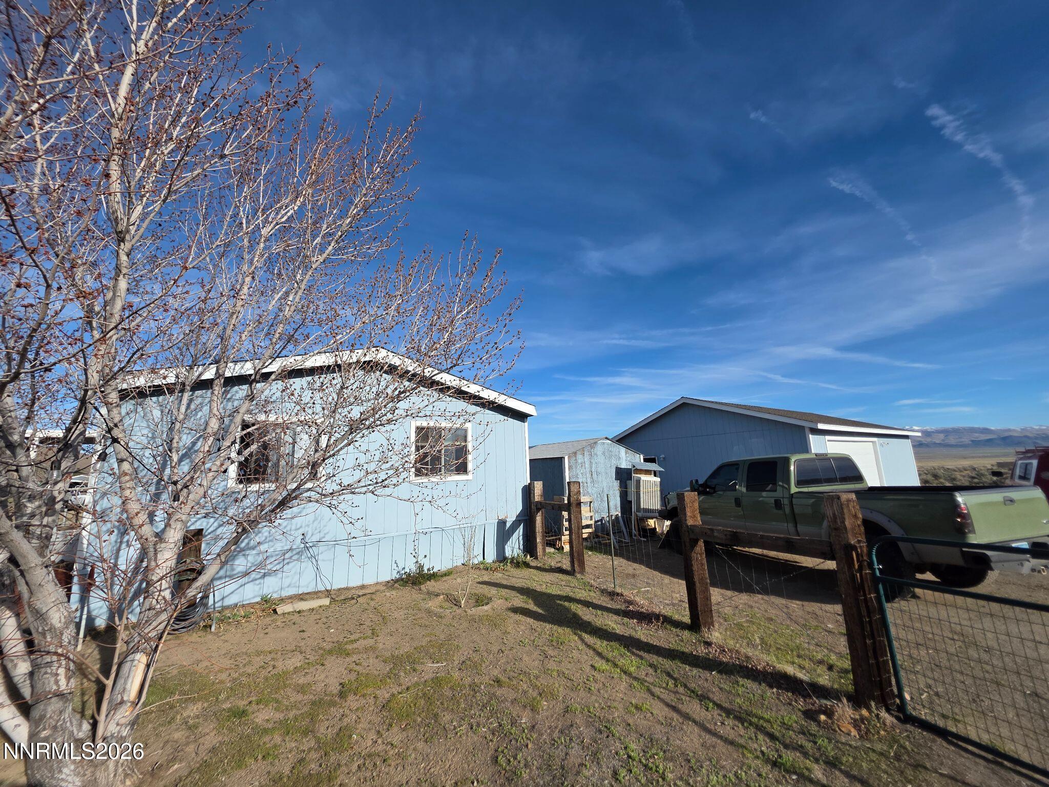 3985 Granite Way Topaz Ranch Estates, NV 89444 - Photo 6 of 34 a view of a yard and car parked in the back