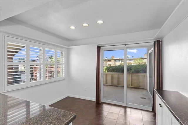 a view of an empty room with glass door