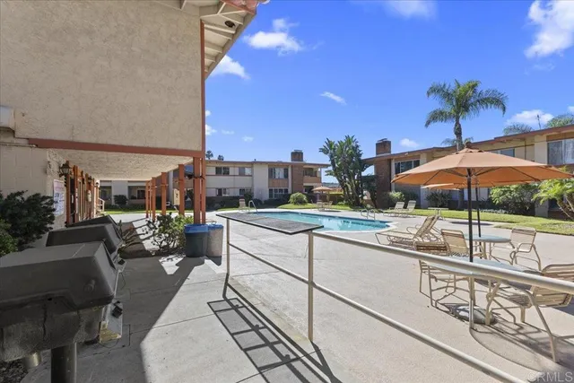 a view of swimming pool with outdoor seating