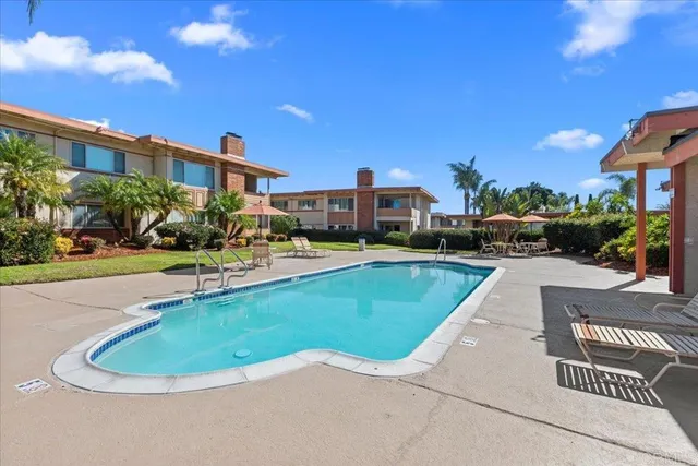 a view of a swimming pool with a patio