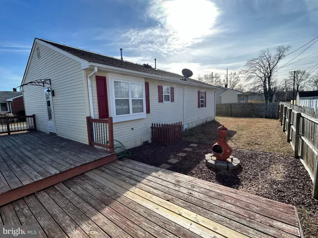 a front view of house with yard outdoor seating and barbeque oven