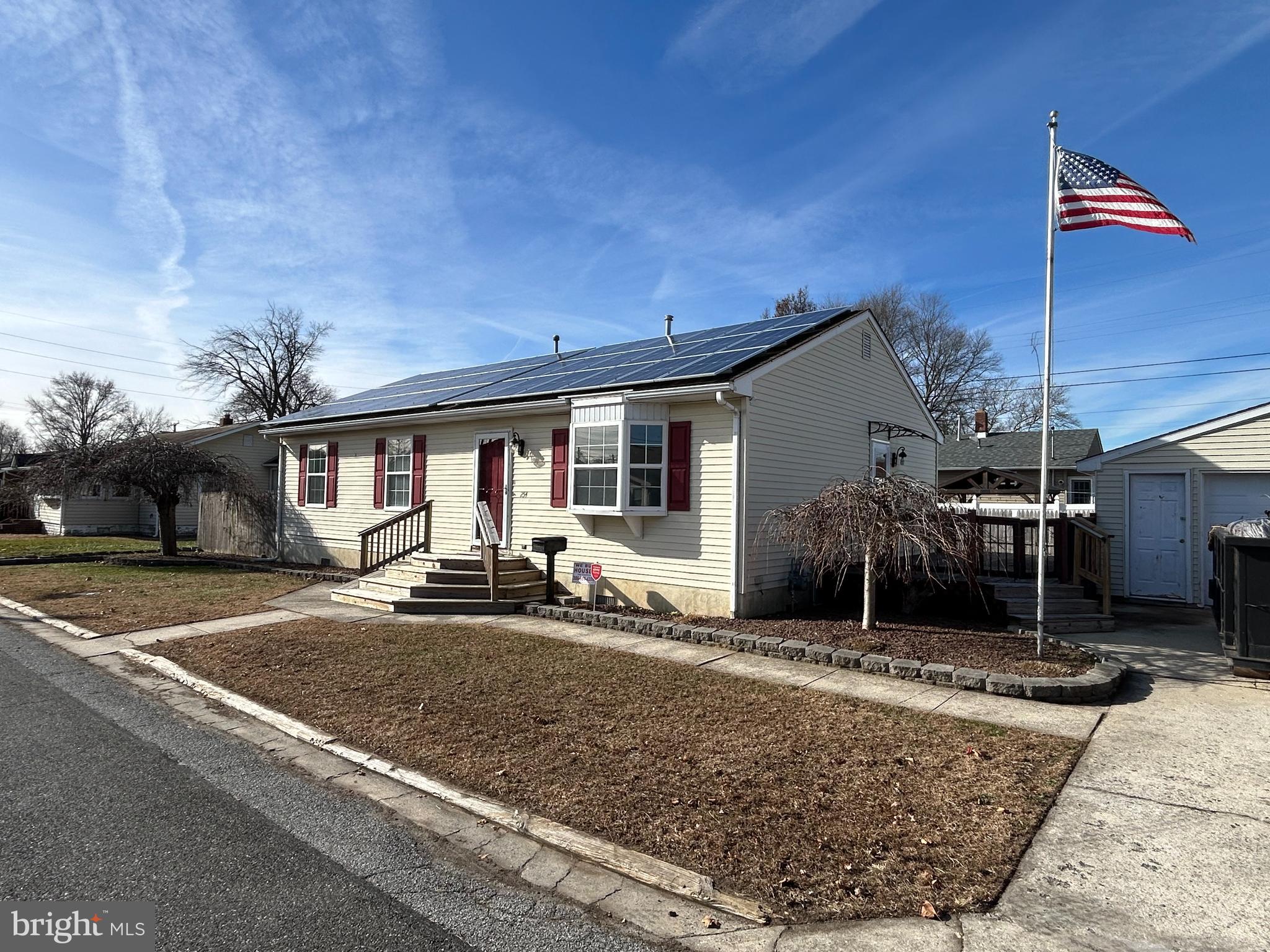 254 G Street Carneys Point, NJ 08069 - Photo 2 of 19 a front view of a house with garden