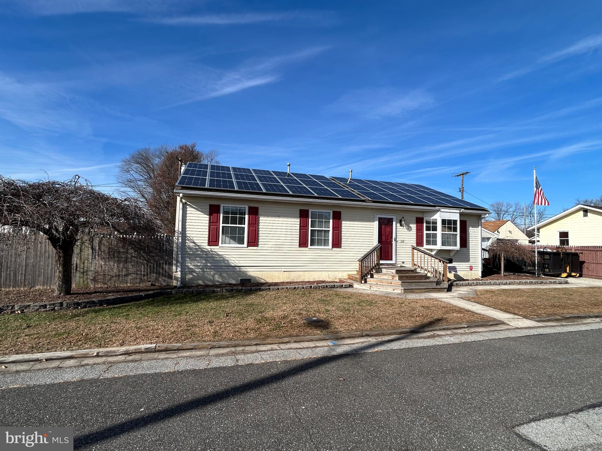 254 G Street Carneys Point, NJ 08069 - Photo 4 of 19 a front view of a house with basket ball court and outdoor seating