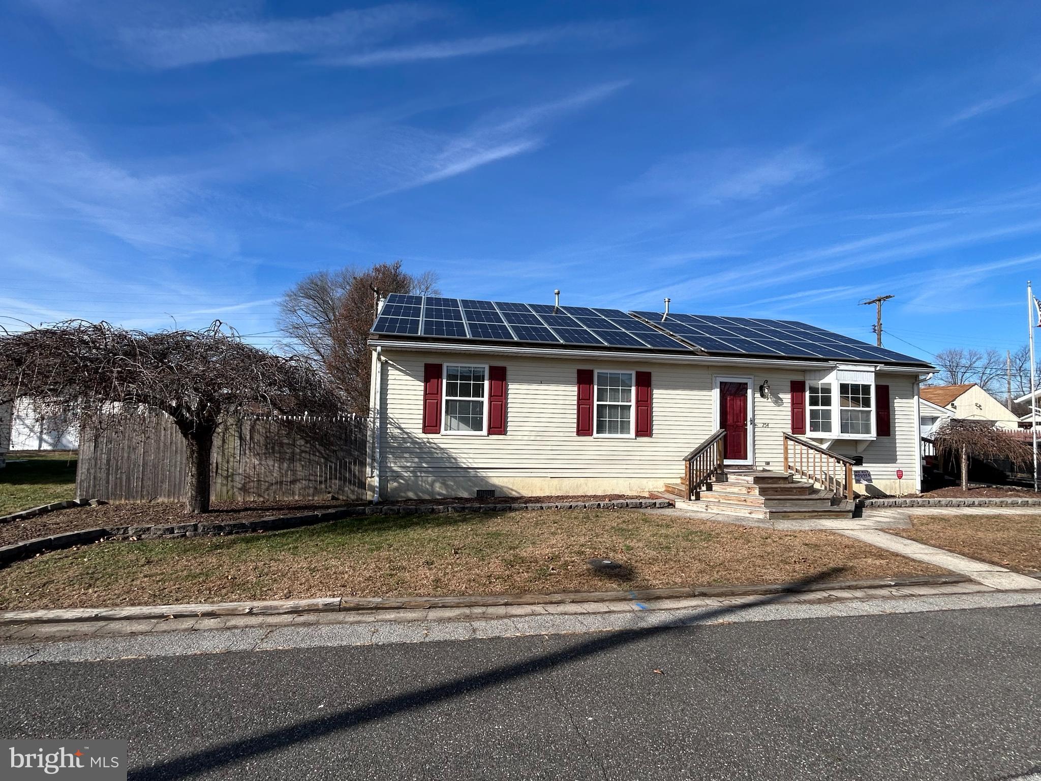 254 G Street Carneys Point, NJ 08069 - Photo 5 of 19 a front view of a house with a yard