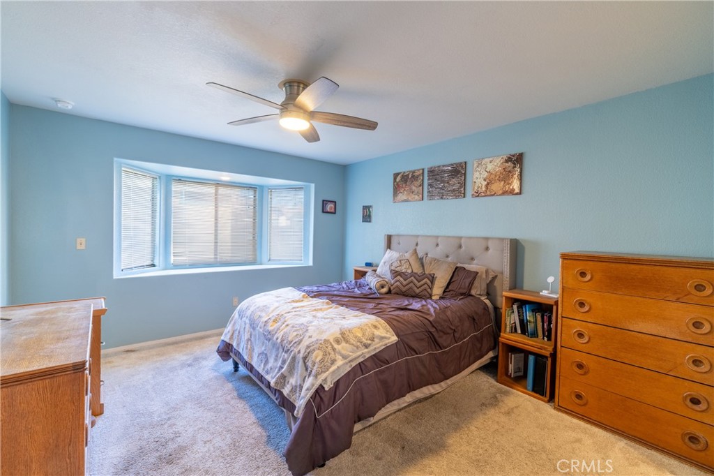 1277 Belridge Street, Unit 1A Oceano, CA 93445 - Photo 16 of 24 a bedroom with a bed and a window