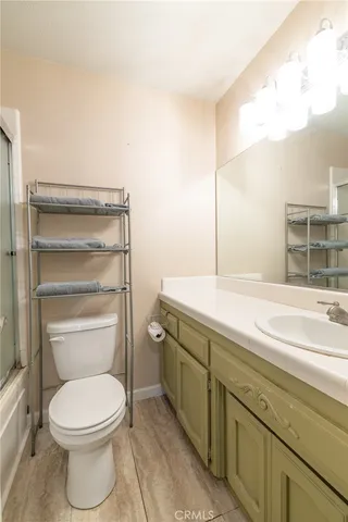 a bathroom with a toilet and a sink