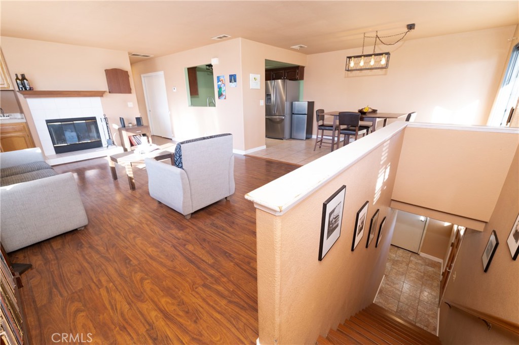 1277 Belridge Street, Unit 1A Oceano, CA 93445 - Photo 6 of 24 a living room with furniture and a fireplace