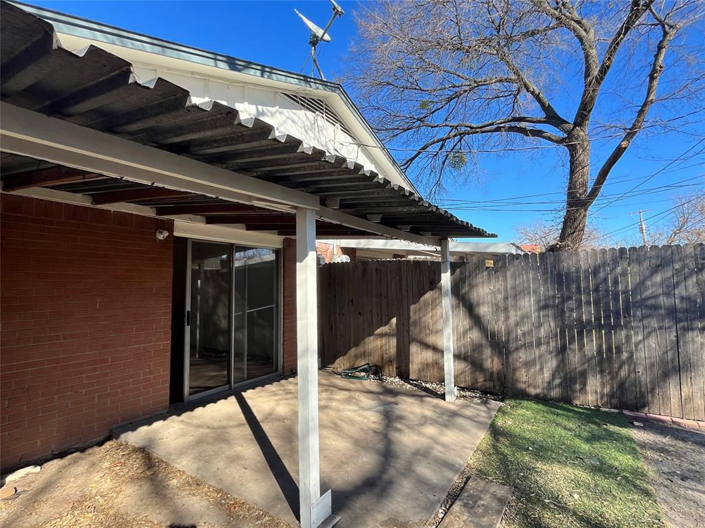 2427 January Lane Grand Prairie, TX 75050 - Photo 13 of 14 a view of a backyard