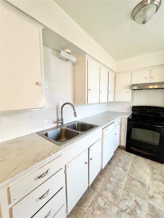 2427 January Lane Grand Prairie, TX 75050 - Photo 5 of 14 a kitchen with sink and cabinets