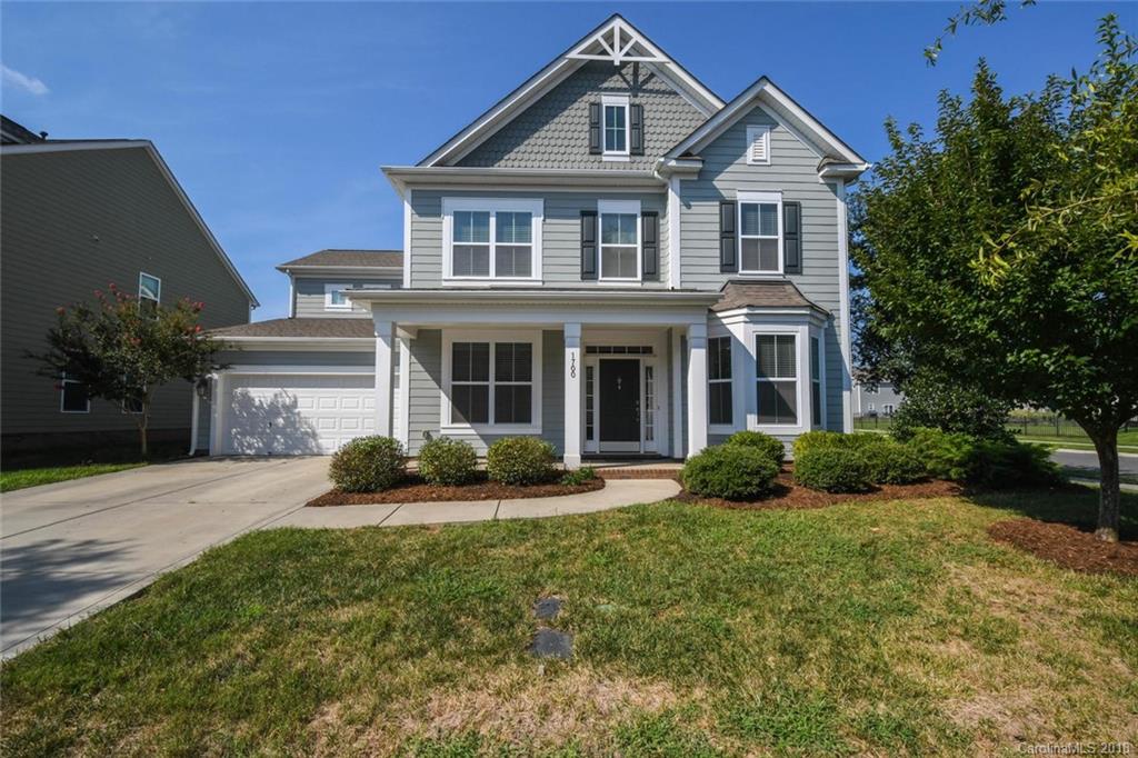 1700 Ridgehaven Road Waxhaw, NC 28173 - Photo 1 of 27 a front view of a house with a yard and garage