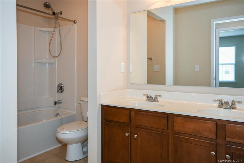 1700 Ridgehaven Road Waxhaw, NC 28173 - Photo 22 of 27 a bathroom with a sink a toilet and shower