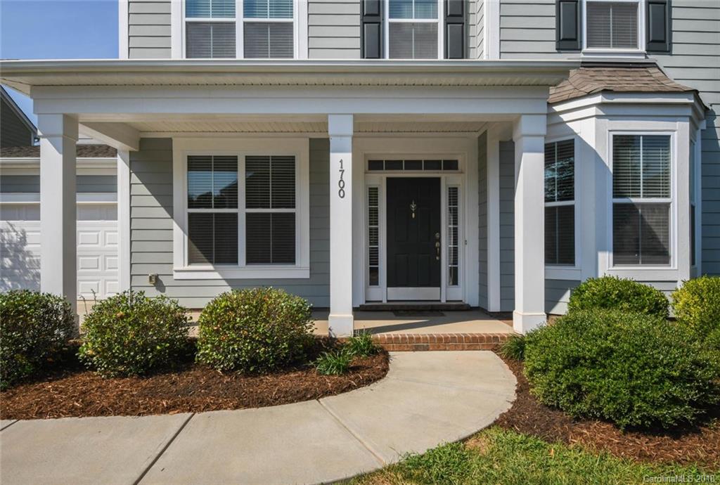 1700 Ridgehaven Road Waxhaw, NC 28173 - Photo 4 of 27 front view of a brick house with a yard