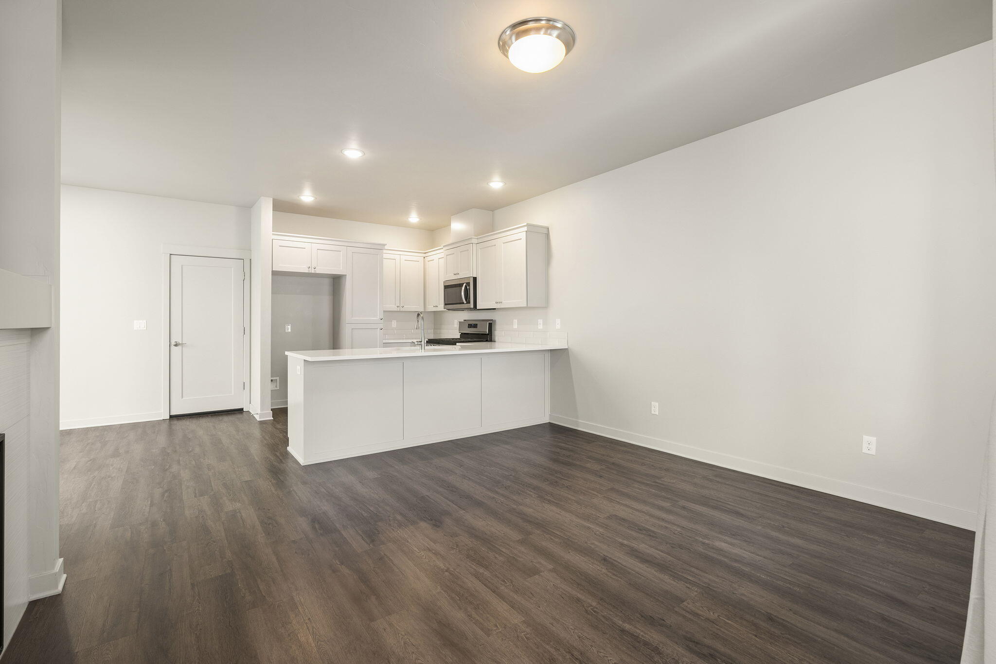 2366 Northeast Victor Place Bend, OR 97701 - Photo 7 of 31 a view of kitchen with wooden floor and window