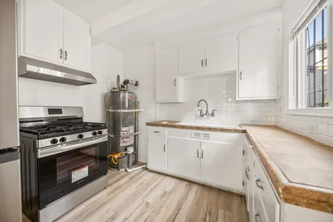 a kitchen with a stove and a sink