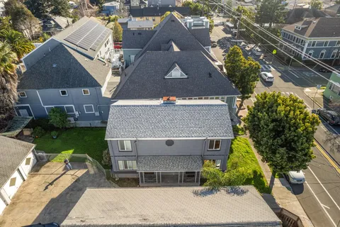 an aerial view of a house with a garden