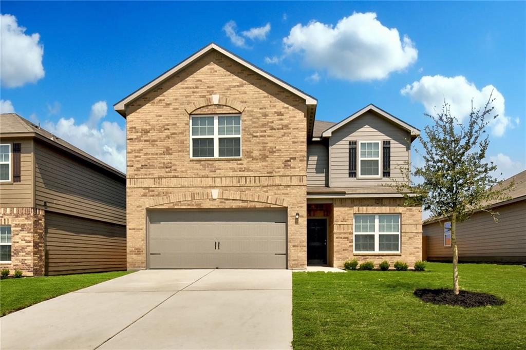 105 Brunswick Lane Jarrell, TX 76537 - Photo 1 of 18 a front view of a house with a yard