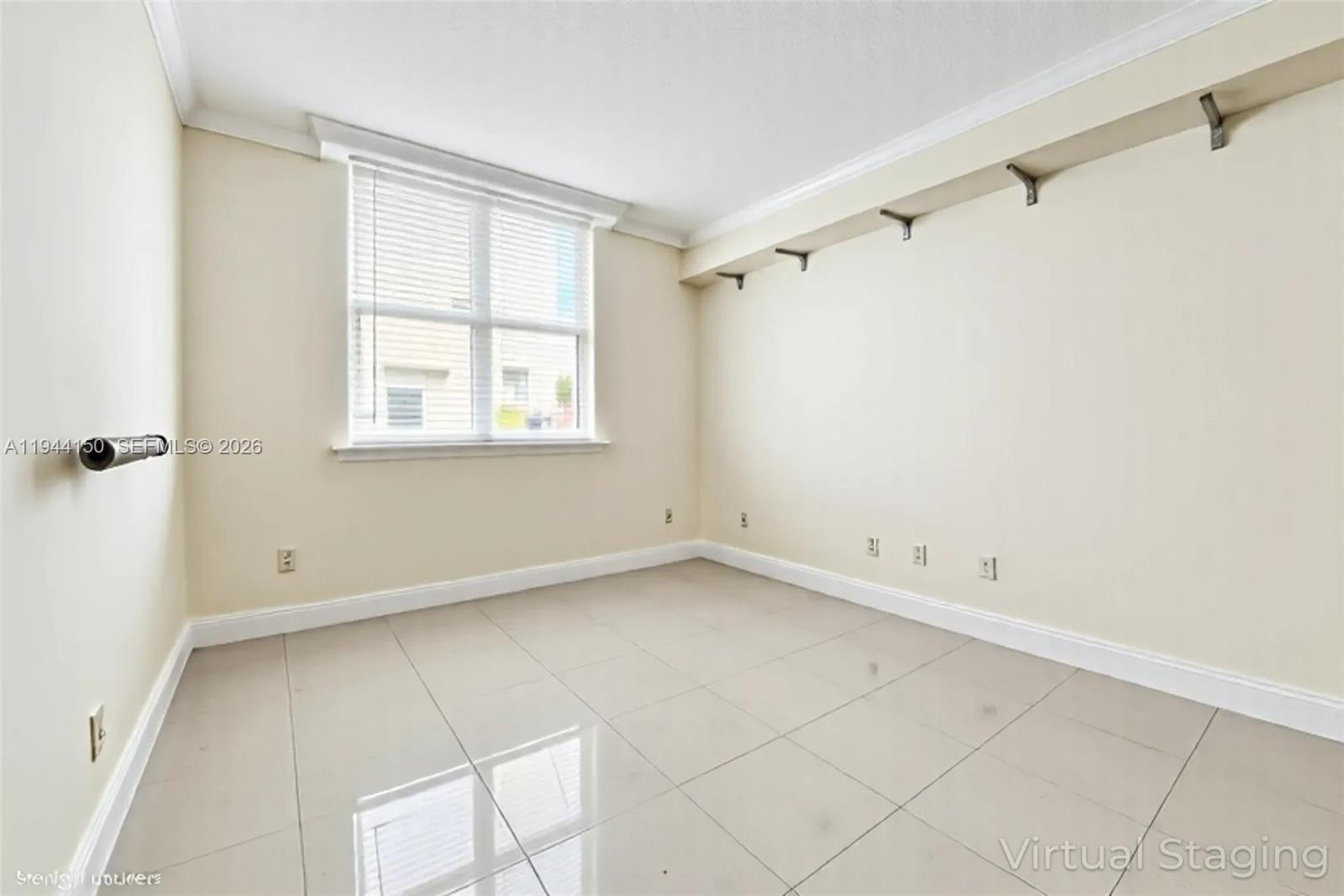 2030 Douglas Road, Unit 511 Coral Gables, FL 33134 - Photo 9 of 19 a view of an empty room with a window