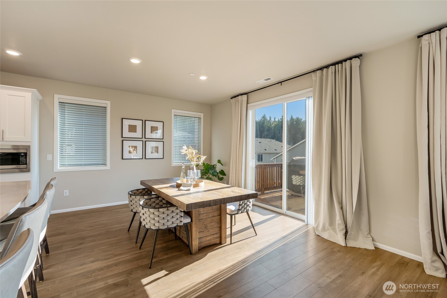28931 239th Avenue Southeast Maple Valley, WA 98010 - Photo 11 of 37 a view of a dining room with furniture window and wooden floor