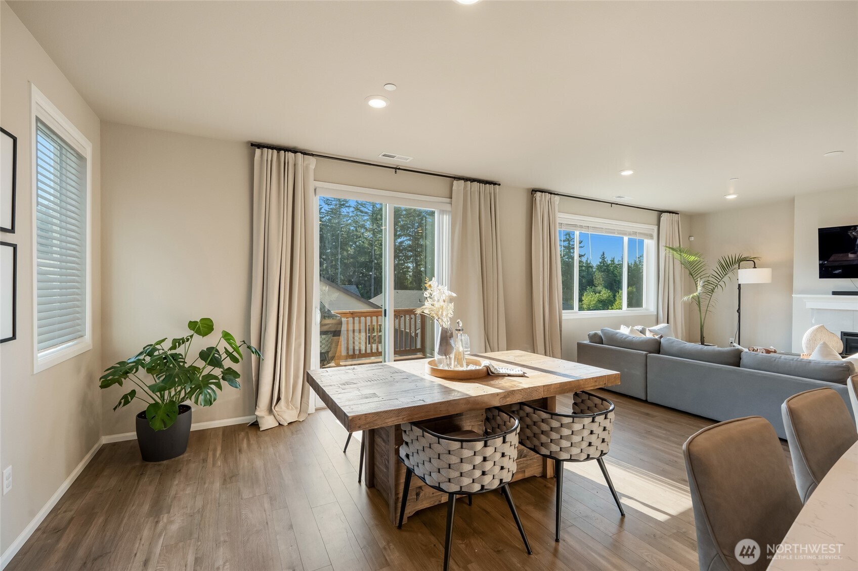 28931 239th Avenue Southeast Maple Valley, WA 98010 - Photo 12 of 37 a view of a dining room with furniture window and wooden floor