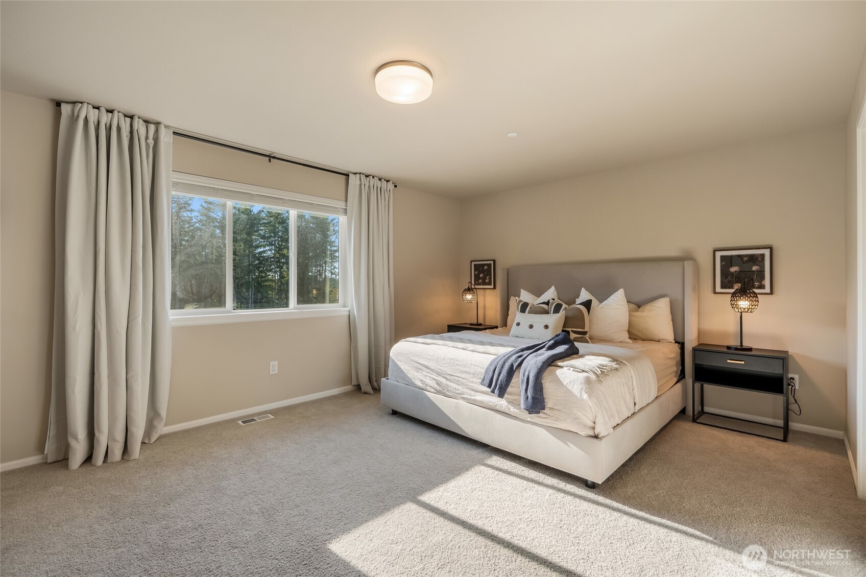 28931 239th Avenue Southeast Maple Valley, WA 98010 - Photo 16 of 37 a bedroom with a bed and a large window