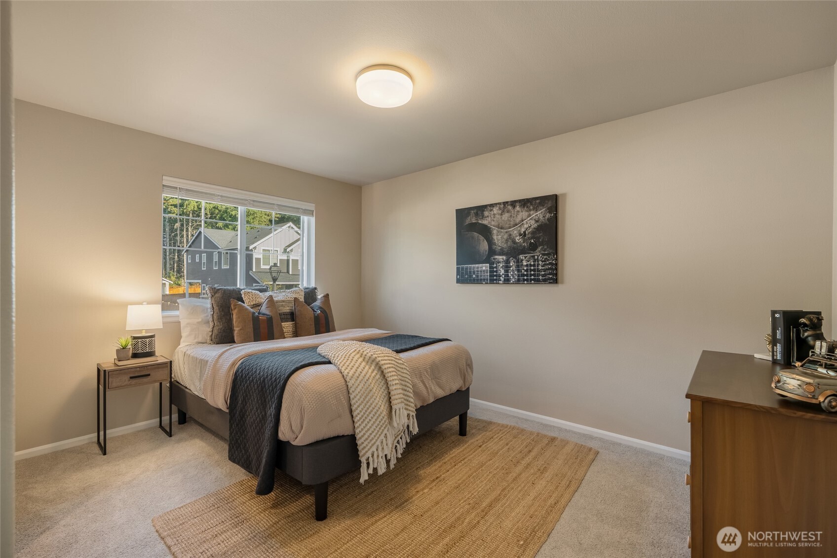 28931 239th Avenue Southeast Maple Valley, WA 98010 - Photo 19 of 37 a bed room with a bed and a night stand