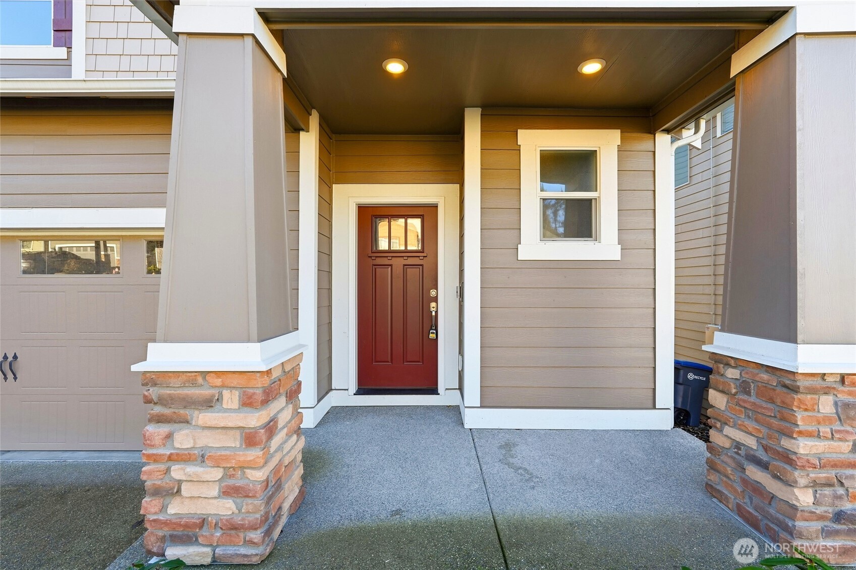 28931 239th Avenue Southeast Maple Valley, WA 98010 - Photo 2 of 37 a front view of a house with a garage