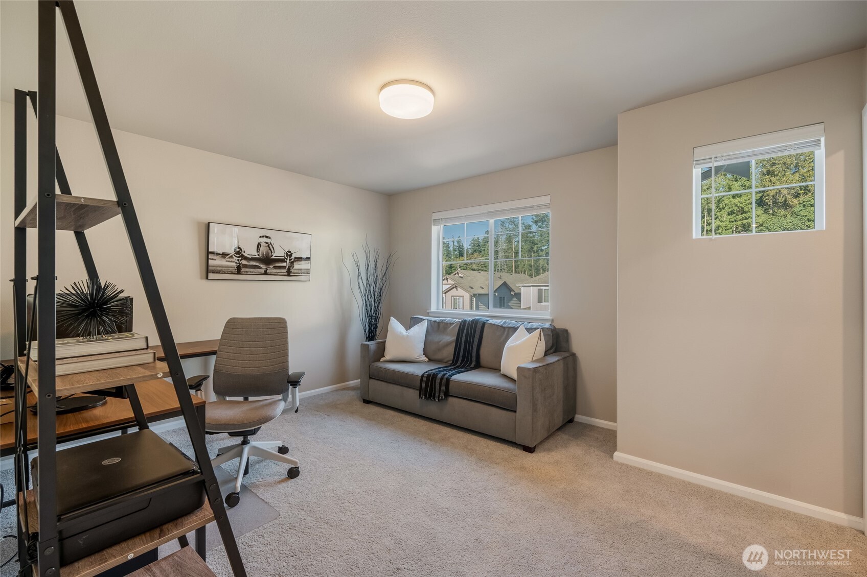 28931 239th Avenue Southeast Maple Valley, WA 98010 - Photo 22 of 37 a living room with furniture and a window