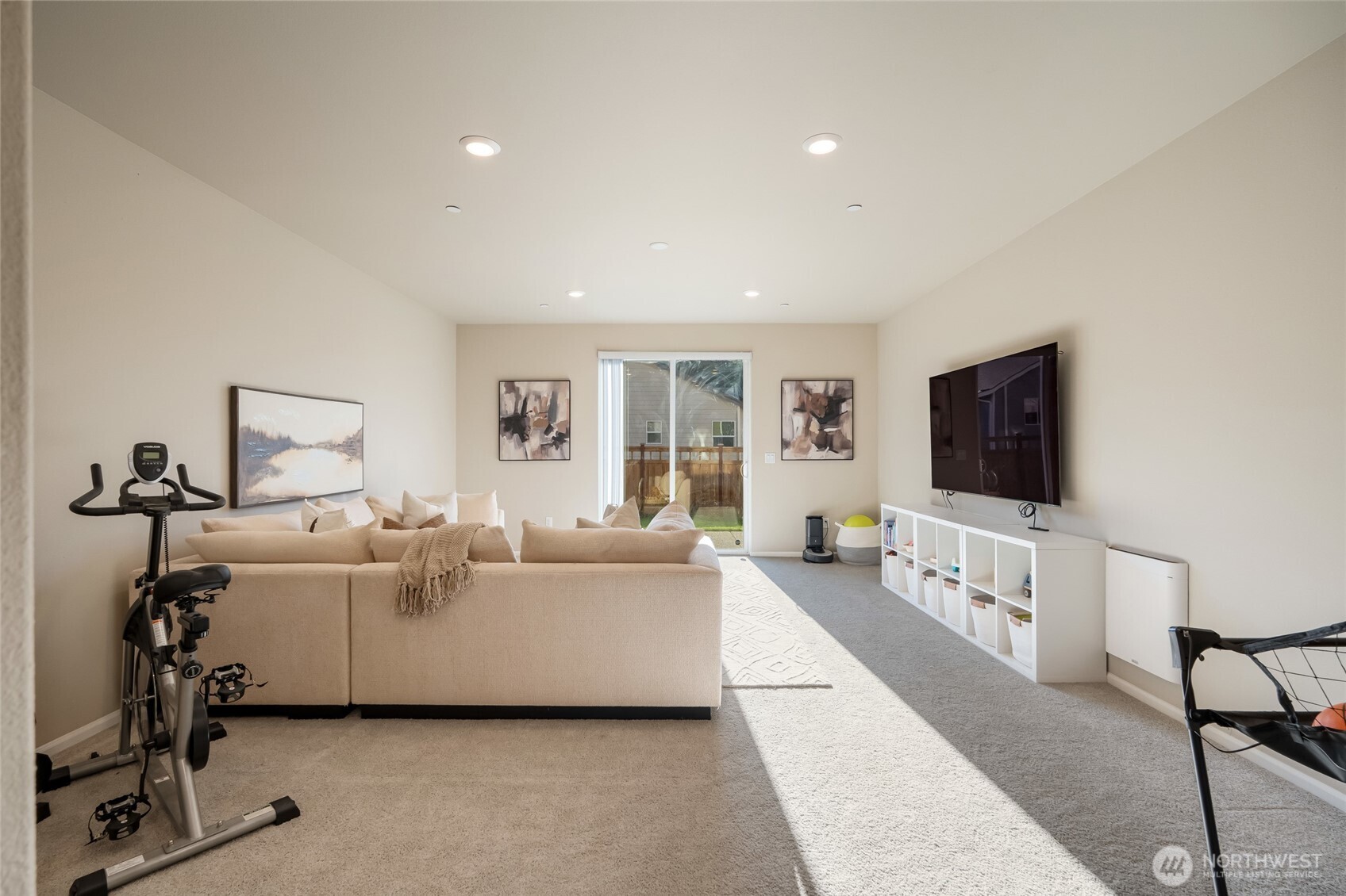 28931 239th Avenue Southeast Maple Valley, WA 98010 - Photo 23 of 37 a living room with furniture and a flat screen tv