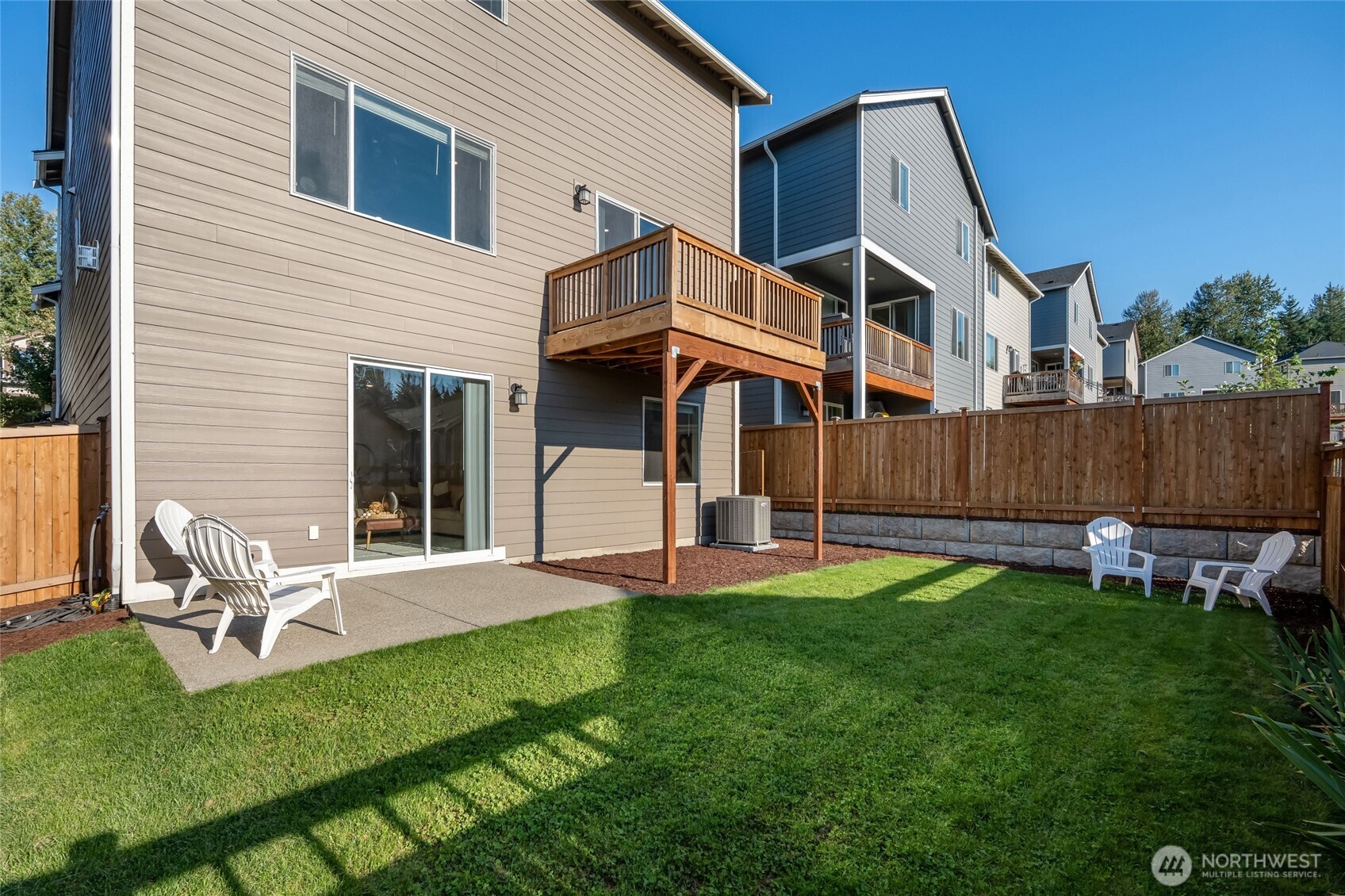28931 239th Avenue Southeast Maple Valley, WA 98010 - Photo 28 of 37 a view of a house with a yard and sitting area