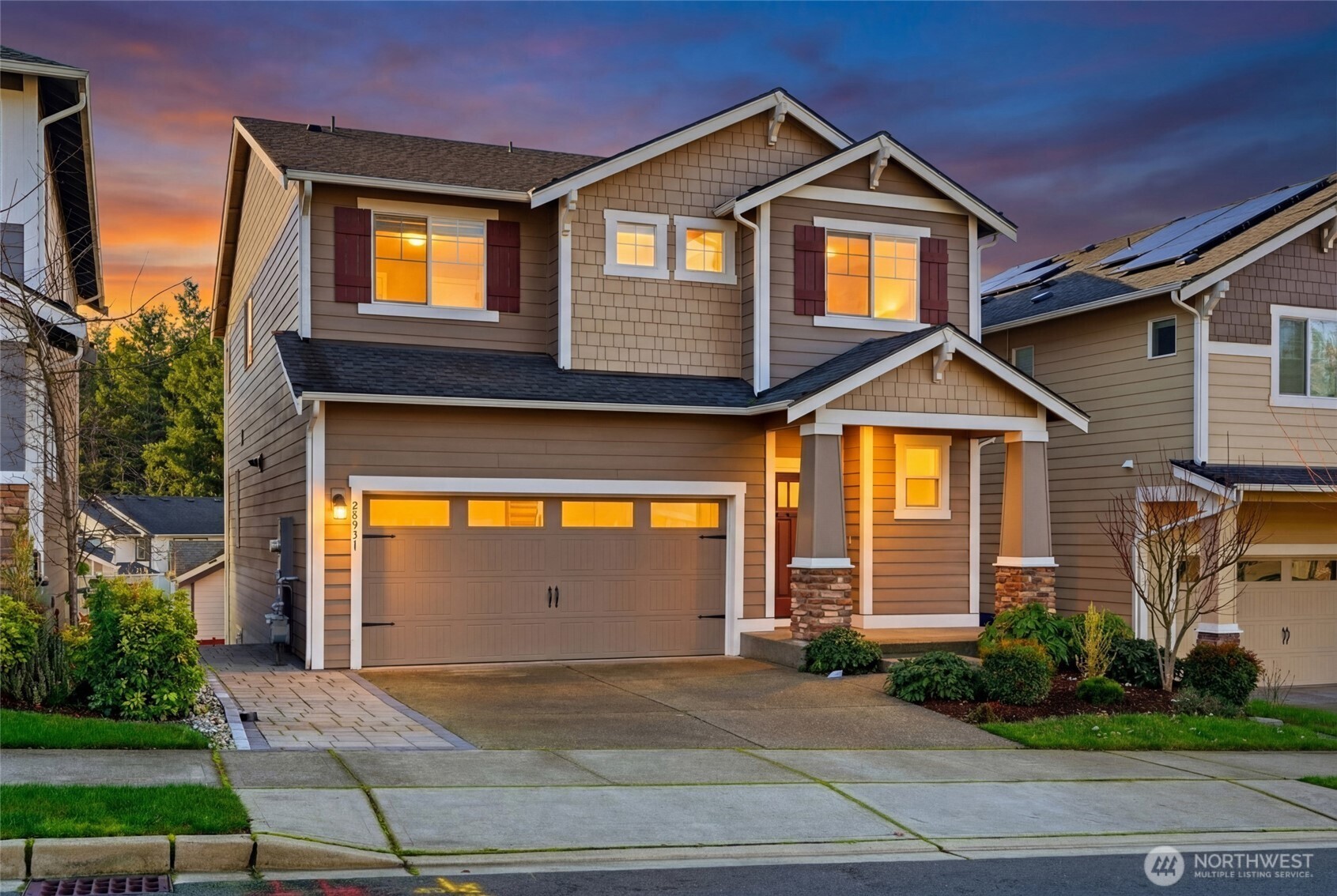 28931 239th Avenue Southeast Maple Valley, WA 98010 - Photo 35 of 37 a front view of a house with a yard and garage