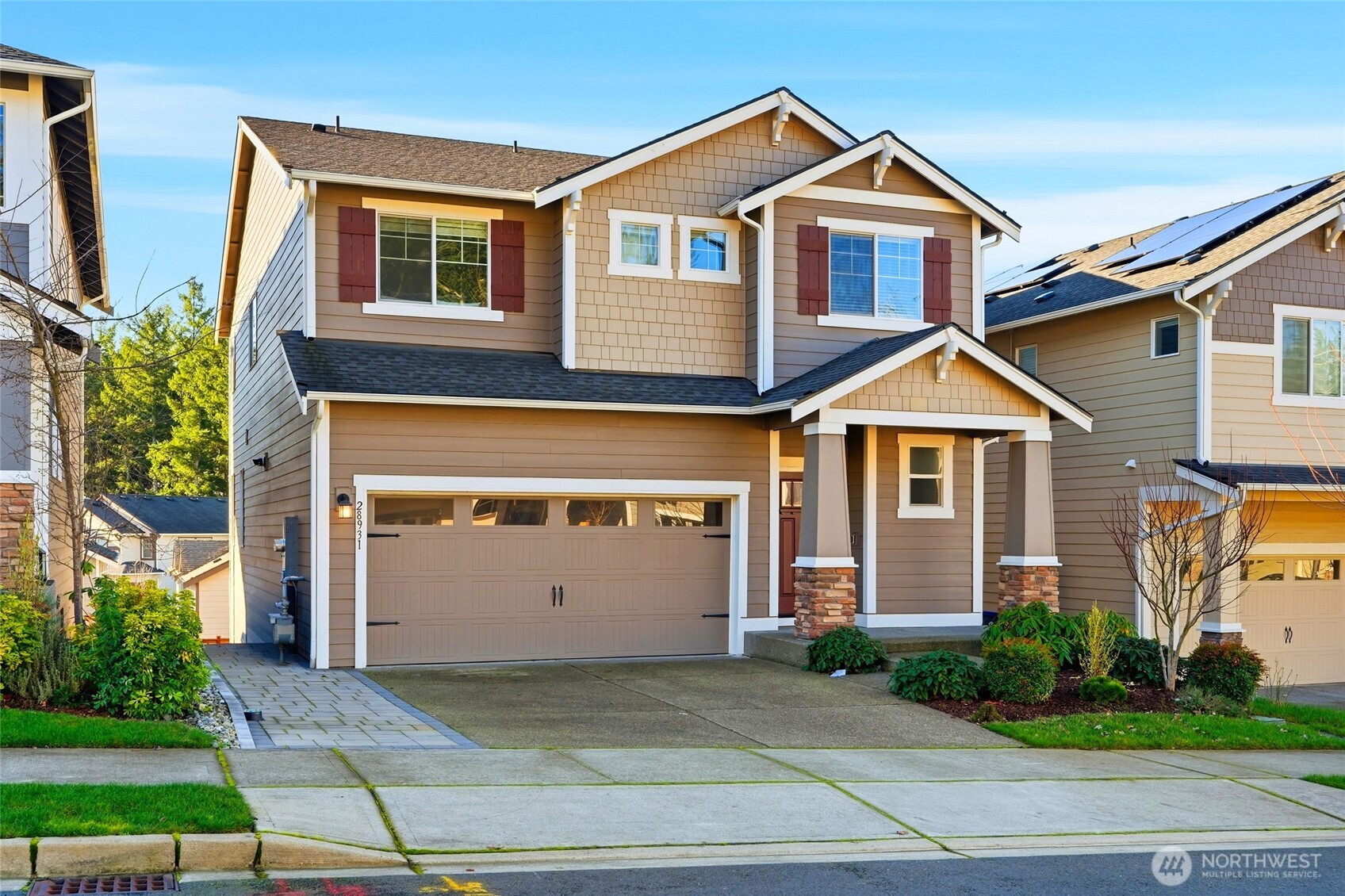 28931 239th Avenue Southeast Maple Valley, WA 98010 - Photo 37 of 37 a front view of a house with a yard and garage