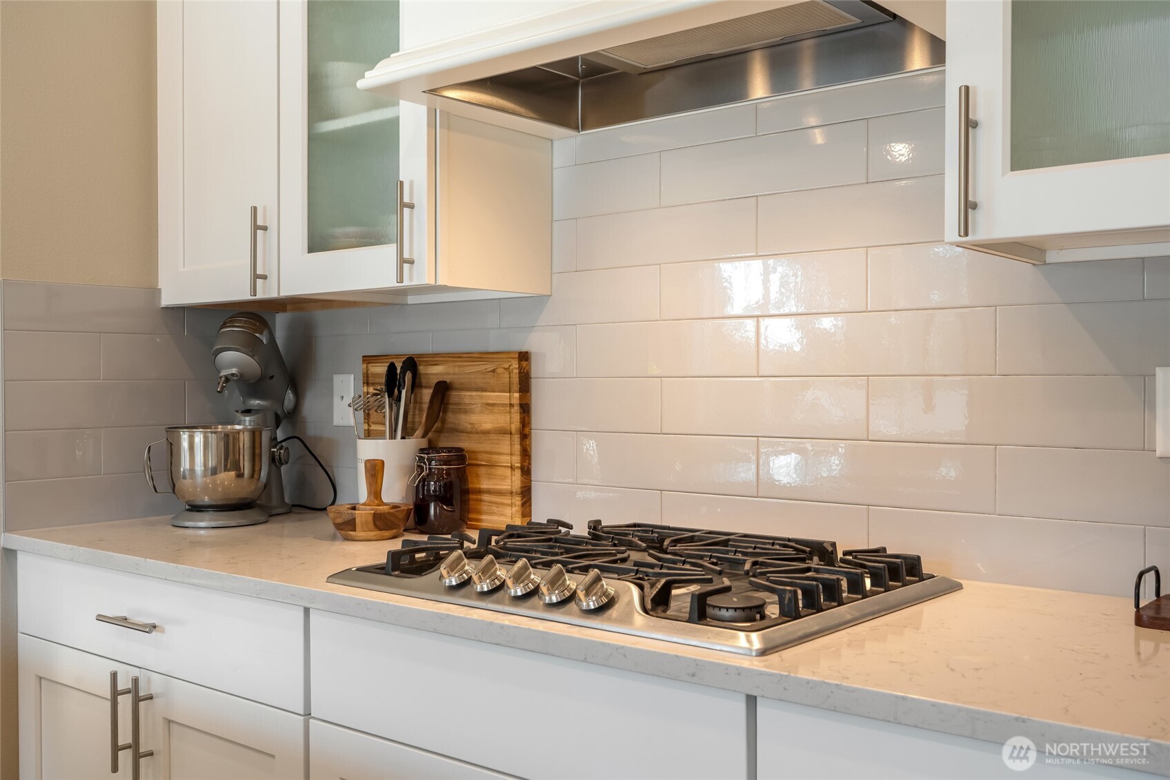 28931 239th Avenue Southeast Maple Valley, WA 98010 - Photo 10 of 37 a kitchen with granite countertop a stove and cabinets