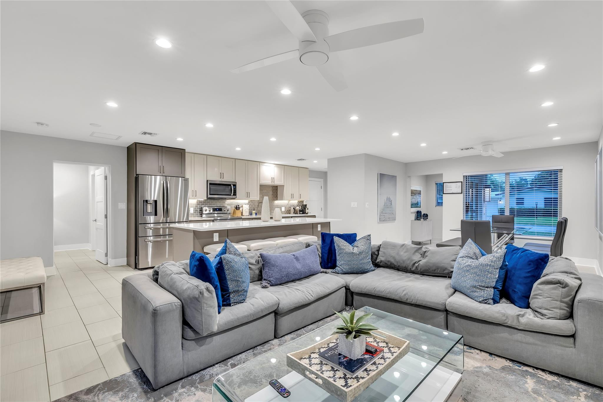 2120 Northeast 34th Court Lighthouse Point, FL 33064 - Photo 16 of 34 a view of a living room kitchen and a wooden floor