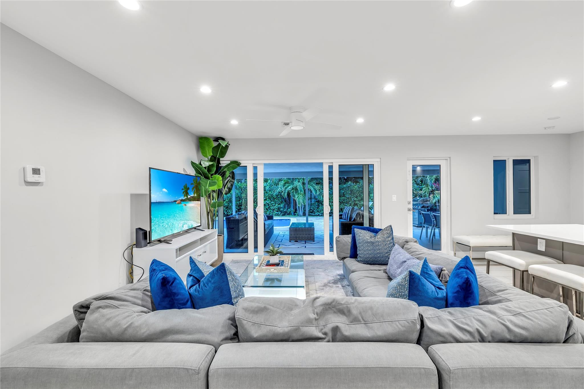 2120 Northeast 34th Court Lighthouse Point, FL 33064 - Photo 17 of 34 a living room with furniture ceiling fan and a large window