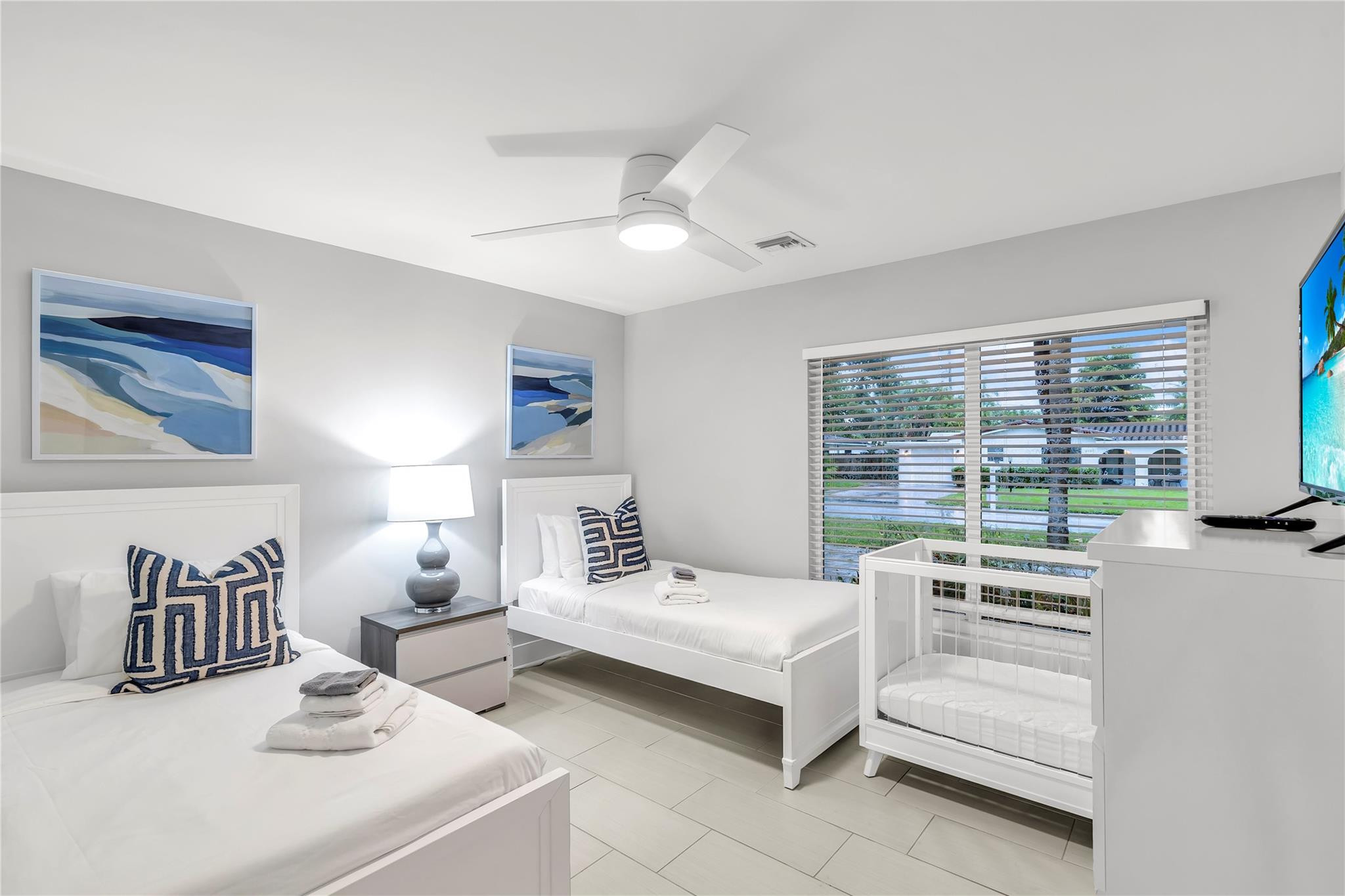 2120 Northeast 34th Court Lighthouse Point, FL 33064 - Photo 21 of 34 a bedroom with furniture and a large window