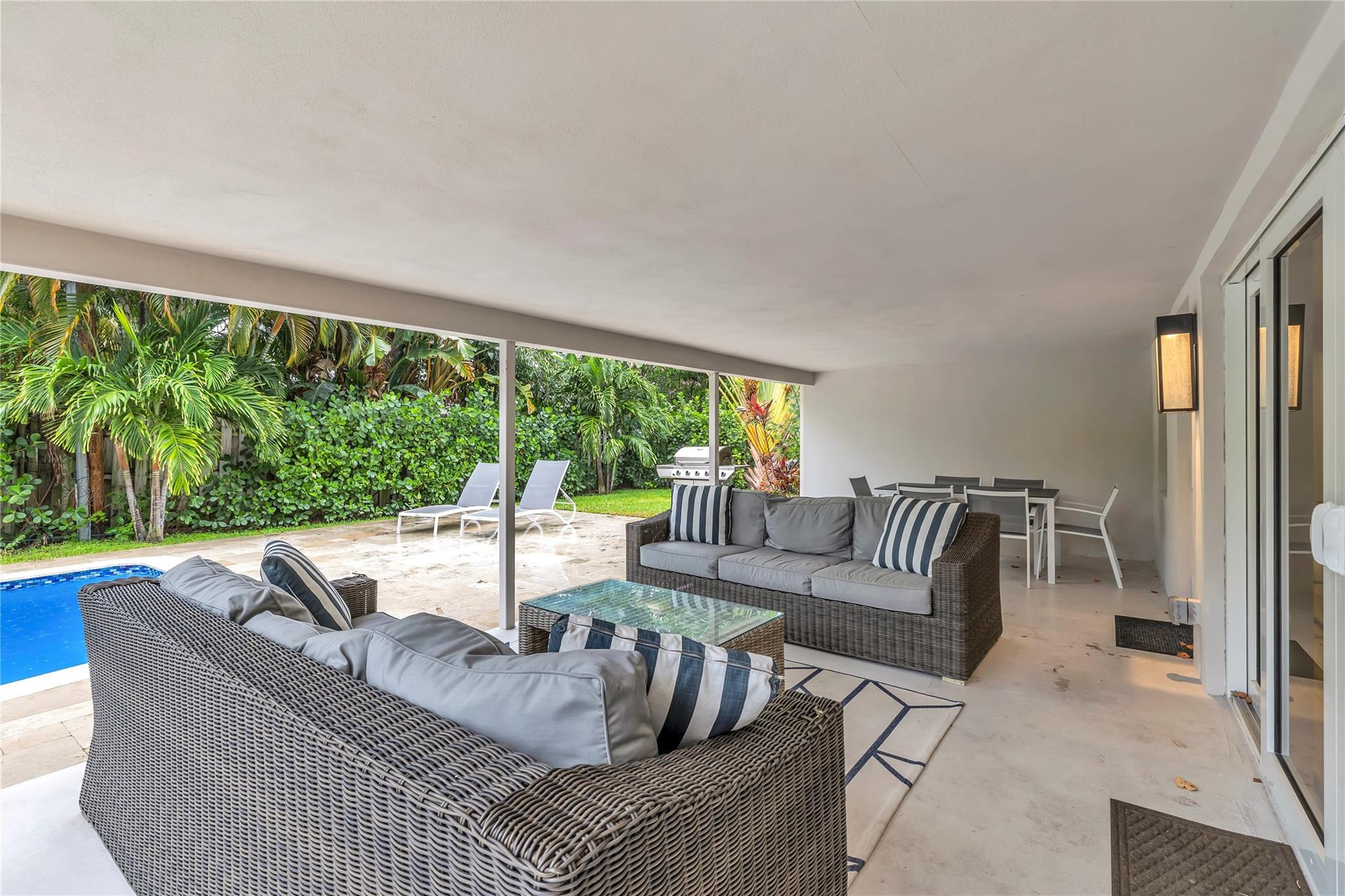 2120 Northeast 34th Court Lighthouse Point, FL 33064 - Photo 30 of 34 a living room with furniture and a large window