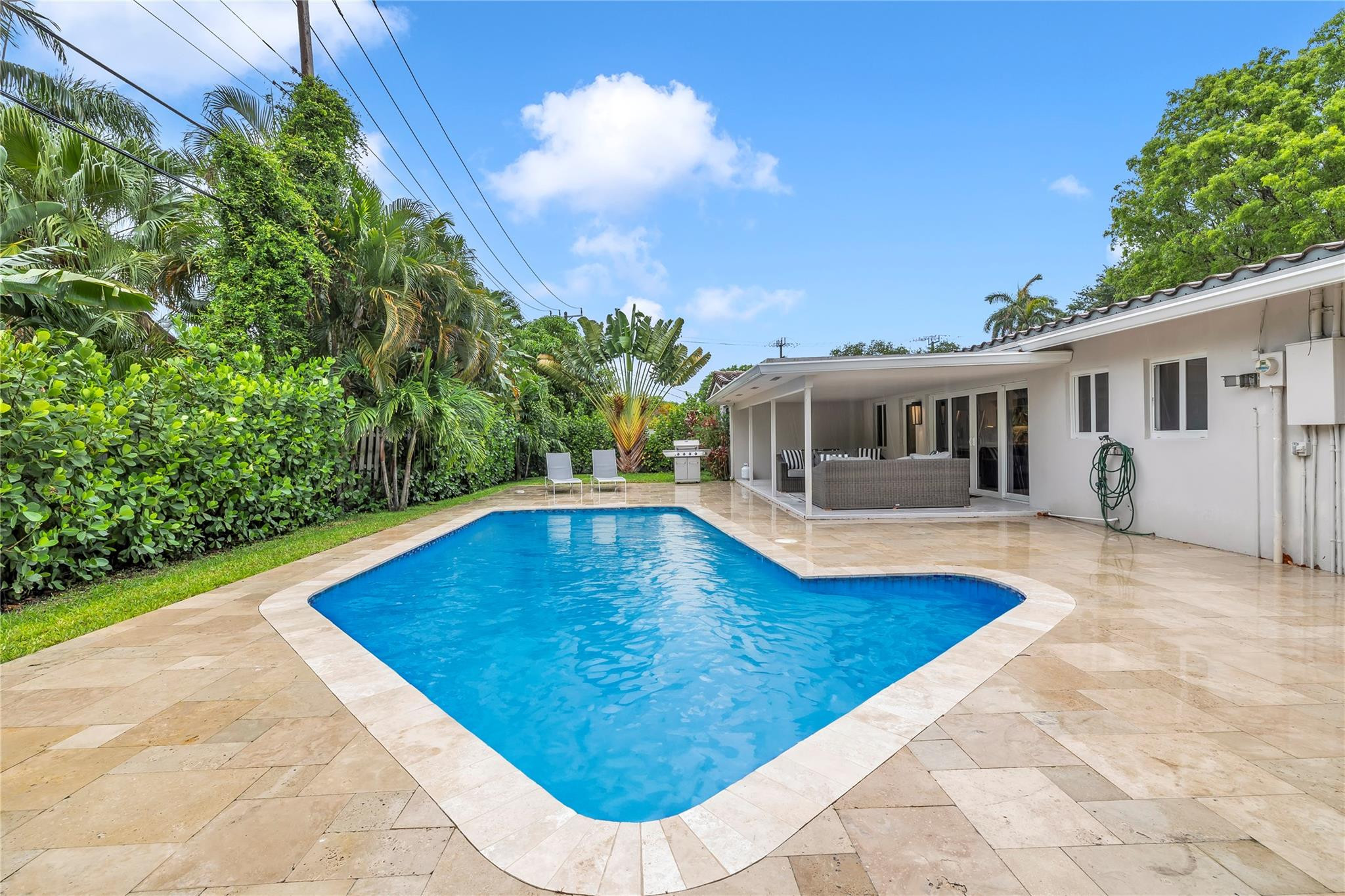 2120 Northeast 34th Court Lighthouse Point, FL 33064 - Photo 6 of 34 a view of a house with pool