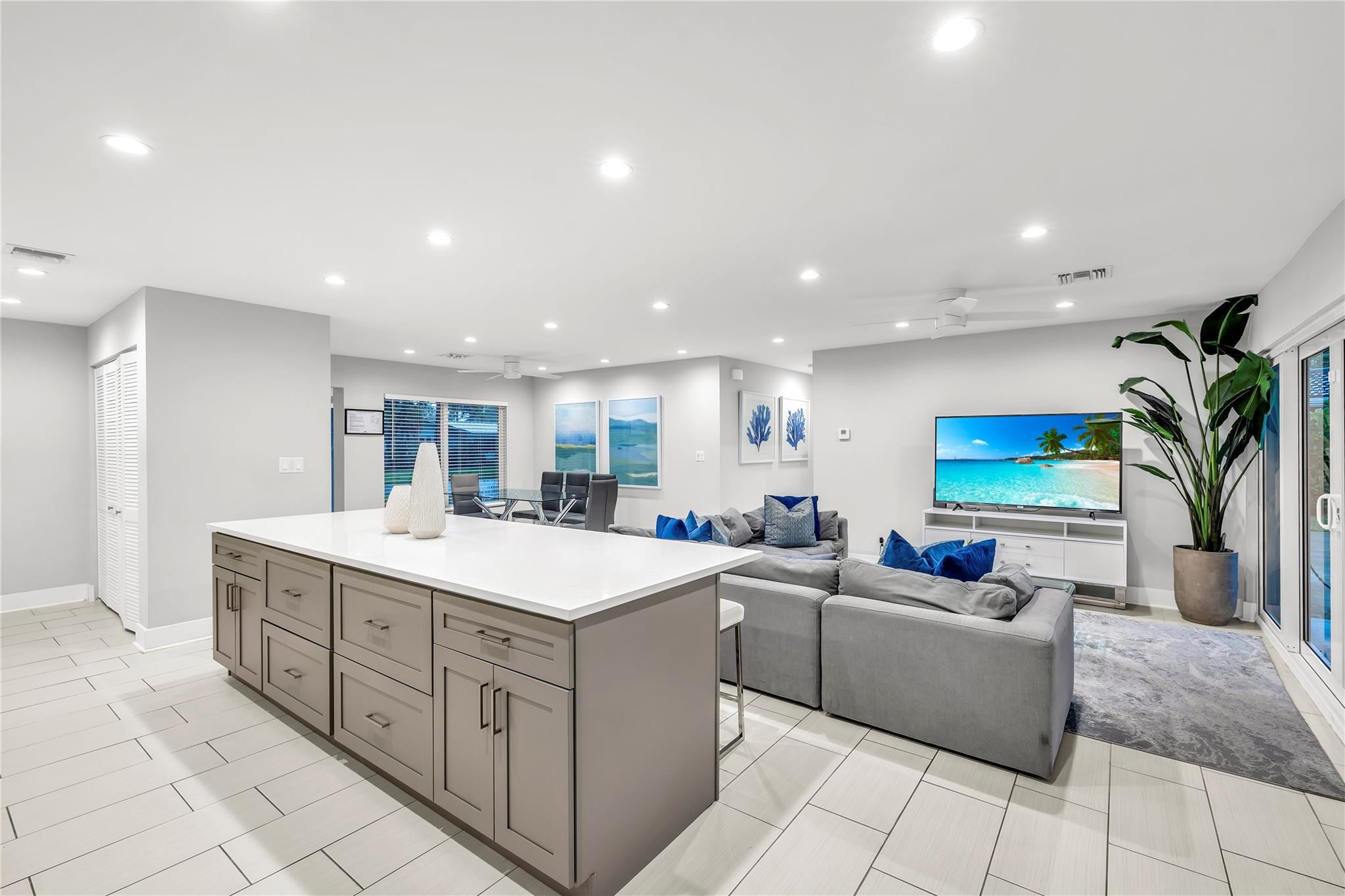 2120 Northeast 34th Court Lighthouse Point, FL 33064 - Photo 10 of 34 a large white kitchen with a sink and cabinets