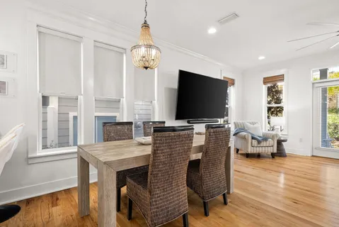 a spacious bathroom with a granite countertop sink a mirror and a bathtub