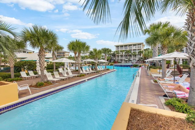 a view of a swimming pool with a table and chairs