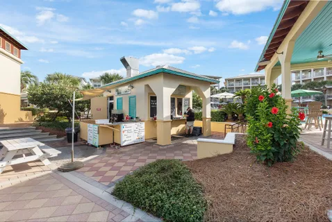 a view of a house with backyard porch and sitting area
