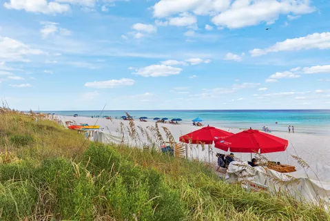 an aerial view of a house with an outdoor space and balcony